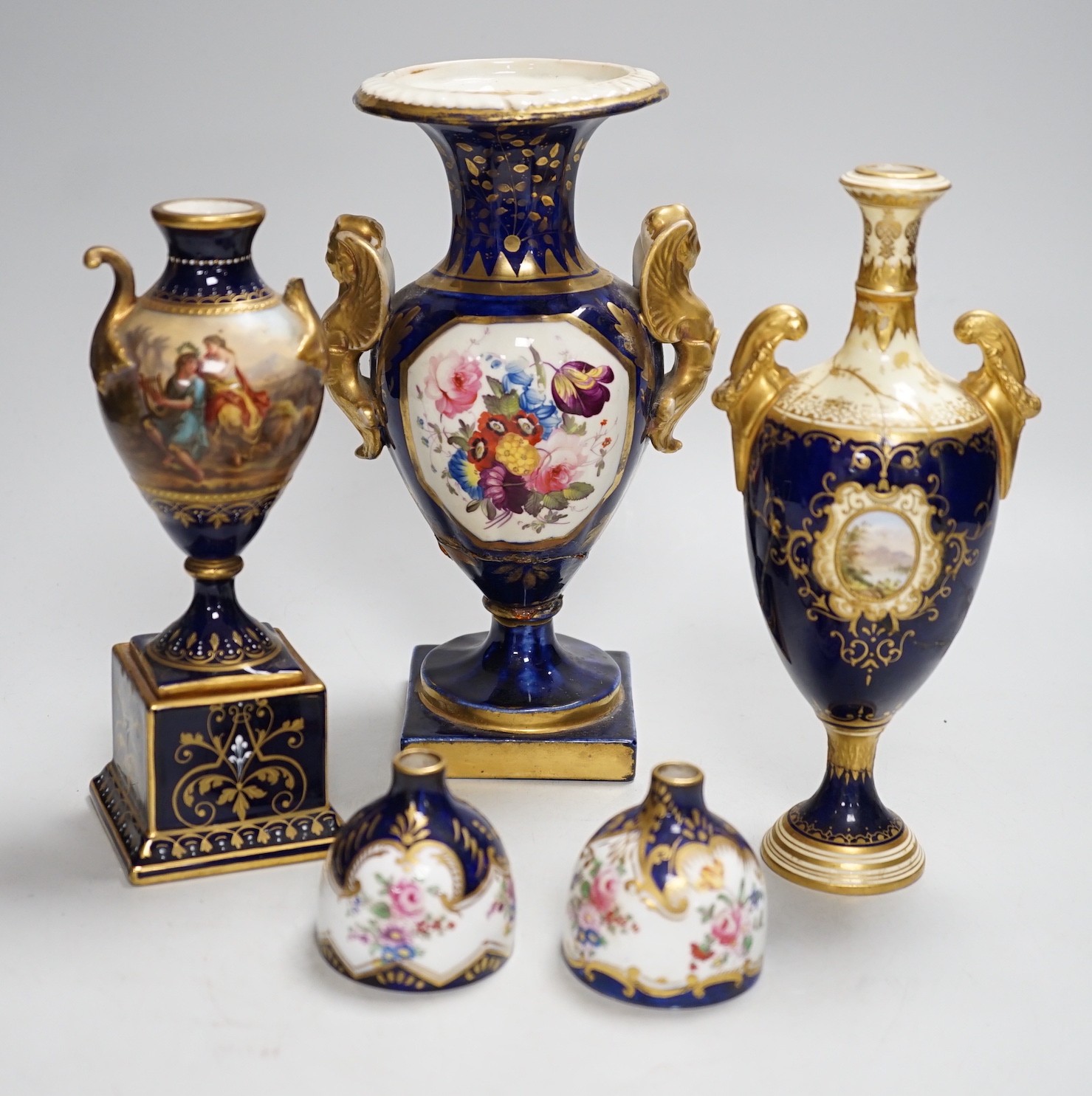 A two-handled pedestal Coalport vase, together with two other vases and a pair of posy vases. Tallest 22cm